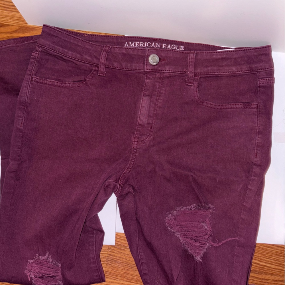 Maroon ripped skinny jeans